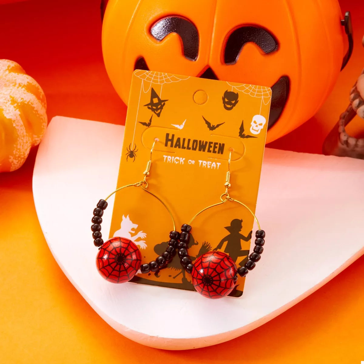 18K gold-plated Halloween bead earrings with red spiderweb beads and black seed beads on hoops