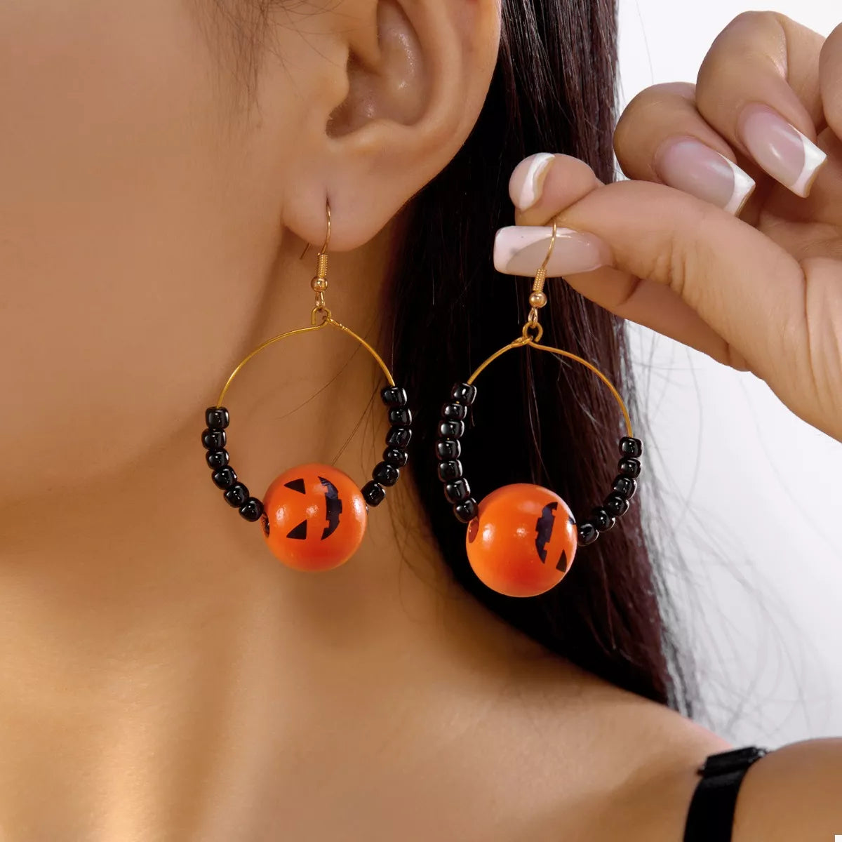18K gold-plated Halloween bead earrings with orange jack-o'-lantern beads and black seed beads on gold hoops